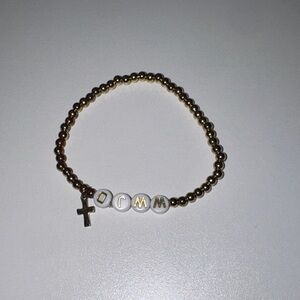 Gold Beaded Bracelet with White Letter Beads and Cross Charm